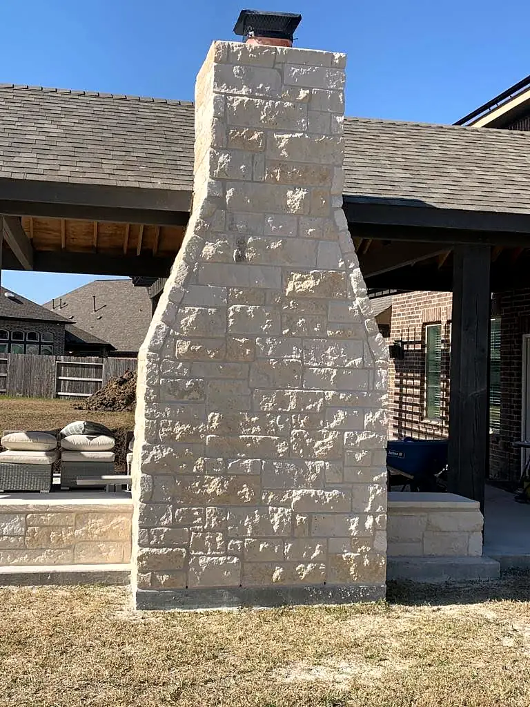 Tall chopped limestone chimney